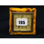 A Circa 1930s Bedside Alarm Clock, Possibly Amber Frame