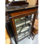 An Edwardian Mahogany Single Door Display Cabinet On Tapered Supports