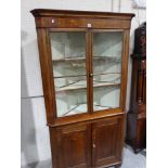 An Antique Oak Two Piece Standing Corner Cupboard