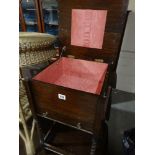 An Early 20th Century Polished Oak Sewing Cabinet