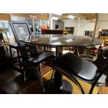 A Contemporary Circular Smoked Glass Breakfast Table With Two Designer Chairs