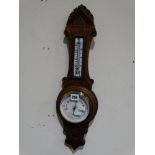 An Edwardian Oak Framed Aneroid Wall Barometer