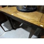 An Early 20th Century Polished Oak Fold Over Top Dining Table On Square Supports