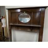 An Edwardian Polished Oak & Mirrored Fire Surround