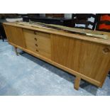 A Retro Lightwood Dining Room Sideboard With Sliding Side Cupboard Doors & Centre Bank Of Four