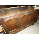 An Antique Oak Three Panel Front Blanket Chest With Two Base Drawers