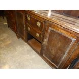 An Early 20th Century Stained Oak Sideboard With Dog Kennel Base