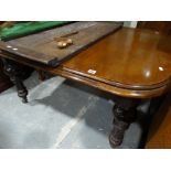 A Late Victorian Oak & Mahogany Extending Dining Table On Turned Supports