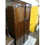 A Polished Carved Oak Bedroom Suite Of Wardrobe, Dressing Chest & Chest Of Drawers