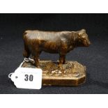 A Black Forest Carved Model Of A Cow, 4" Across