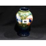A Blue Green Ground Signed Moorcroft Floral Decorated Baluster Vase, 7" High