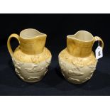 A Pair Of Semi Glazed Stoneware Moulded Hunting Jugs With Stag Hunt Scenes
