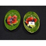 Two Moorcroft Pottery Green Ground Floral Decorated Oval Ashtrays