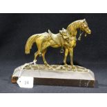 A Lacquered Brass Model Of A Horse On A Wooden Base