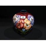 A 1993 Purple Ground Moorcroft Pottery Bulbous Vase, Silver Line Mark To The Base, 7" High