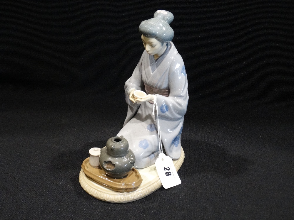 A Lladro Porcelain Figure Of Oriental Lady Taking Tea