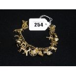 A 9ct Gold Flat Link Bracelet & Charms (1 Charm Non Gold) 32grm All In