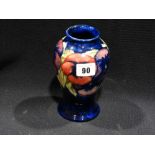 A Circular Based Blue Ground Signed Moorcroft Pottery Vase, 6" High