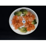A Circular Cream Ground Moorcroft Pottery Charger With Floral Decoration, Signed 10" Dia