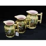 A Graduated Set Of Three Majolica Glazed Moulded Jugs