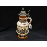 A German Stoneware Pewter Lidded Stein With Tavern Scenes