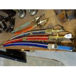 A Group Of Five Brass Handled Replica Swords