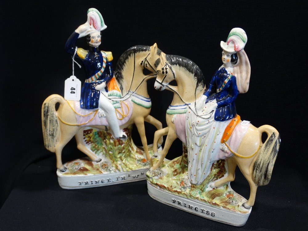 A Pair Of Staffordshire Pottery Equestrian Figures