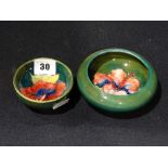 Two Small Moorcroft Pottery Floral Decorated Circular Bowls, Both Retaining Paper Labels To The