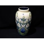 A Cream Ground Floral Decorated Baluster Vase In The Moorcroft Style, 12" High