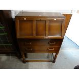 A Polished Oak Finish Bureau