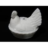 A White Milk Glass Hen On Nest