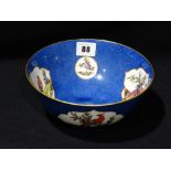 A Circular Based Crown Staffordshire Blue Ground Bowl With Painted Bird Panels, 7.5" Dia