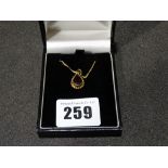 A 9ct Gold Set Garnet Pendant On A Gold Fine Link Chain