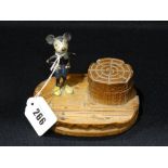 A Cold Painted Early Mickey Mouse Figure Attached To A Wooden Inkwell Base