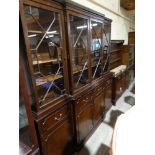 A Mahogany Finish Reproduction Breakfront Four Door Library Bookcase