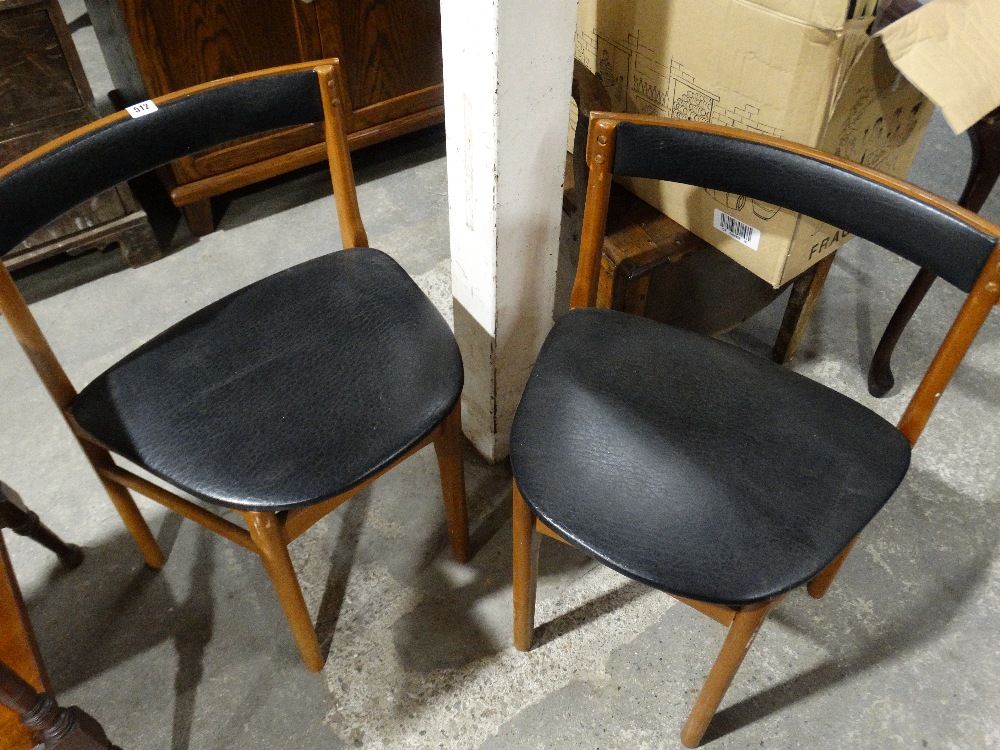 A Pair Of Retro Teak Dining Chairs