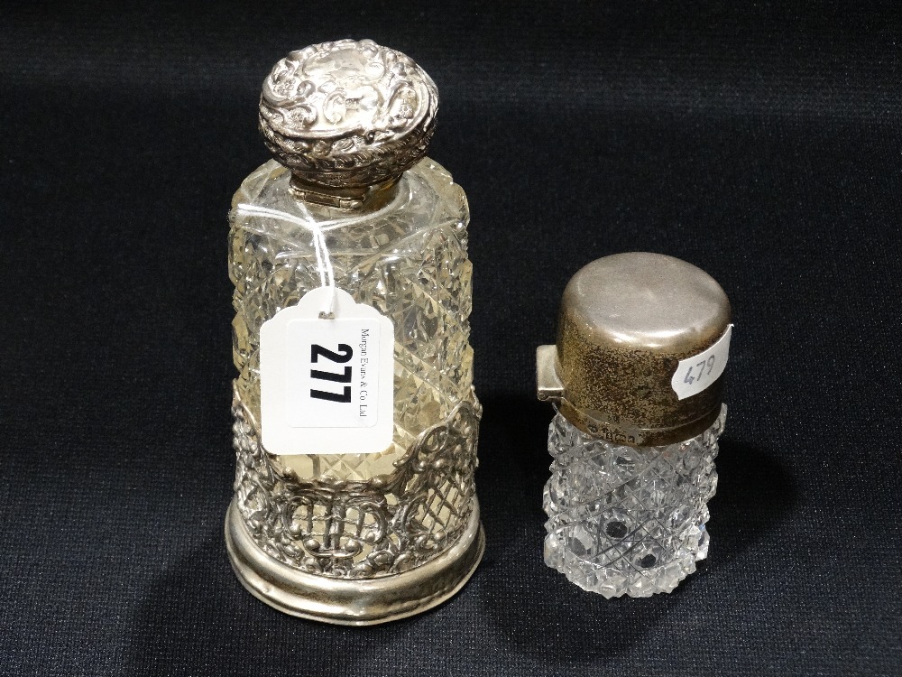 Two Silver Topped Glass Dressing Table Bottles