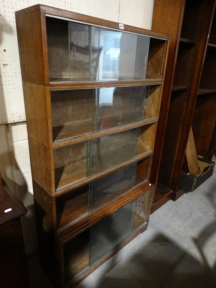 A Five Section Oak Finish Stacking Bookcase