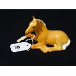 A Beswick Model Foal (Lying), Palomino Finish