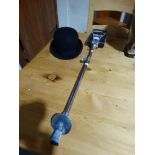 A Vintage Bowler Hat, Together With A Shooting Stick