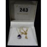 A 9ct Gold Amethyst Set Pendant On A Gold Fine Link Chain