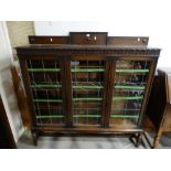 An Early 20th Century Polished Oak Three Door Bookcase Cupboard