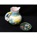A Majolica Glazed Moulded Milk Jug, Together With A Circular Pottery Bowl
