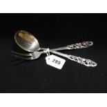 A Norwegian Silver Two Pronged Serving Fork & Spoon With Scroll Pattern