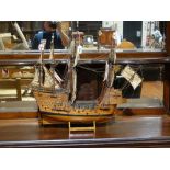 A Scale Model Galleon On A Stand