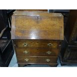 An Early 20th Century Oak Three Drawer Bureau