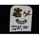 Three 23rd Battalion Welsh Regiment Uniform Badges