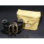 A Pair Of Canvas Cased Military Binoculars Dated 1943