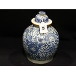 A Blue & White Delft Bulbous Jar & Cover With Leaf Printed Mark To The Base, 11" High