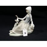 A Lladro Porcelain Group Of Girl & Dove